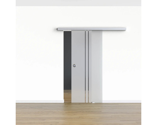 Porte coulissante en verre avec design linéaire devant un mur blanc