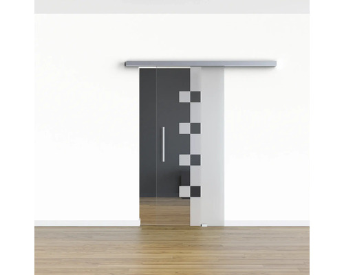 Porte coulissante en verre avec poignée et motif géométrique devant un mur