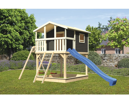 Tour de jeux avec toboggan, échelle et bac à sable dans le jardin
