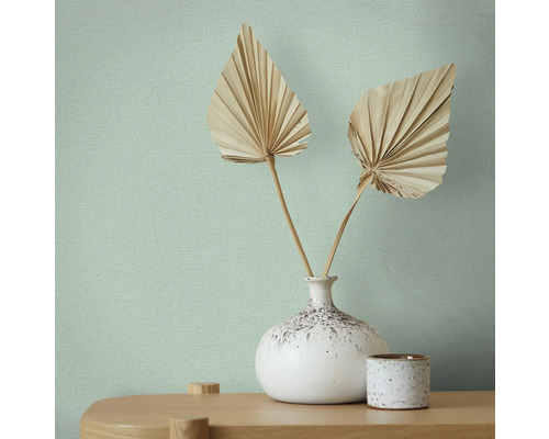 Gros plan d''un papier peint texturé avec une décoration florale dans un vase