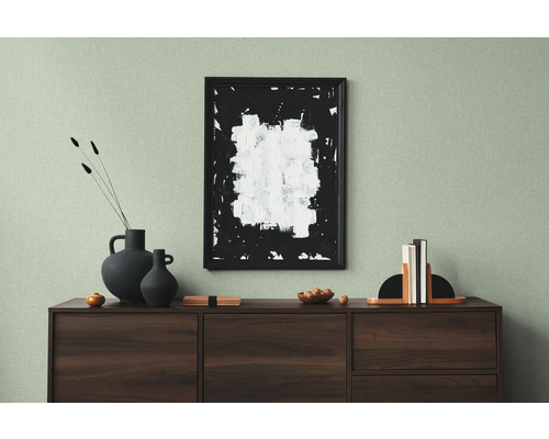 Salon décoratif avec buffet, peinture, vases et serre-livres