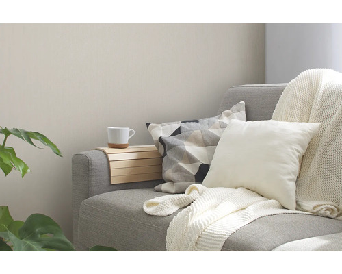 Coin sofa confortable avec coussins, couverture et porte-boissons