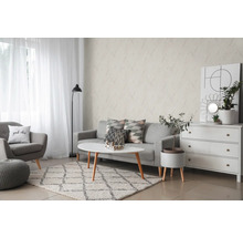 Salon avec canapé, fauteuil, tapis et papier peint mural décoratif