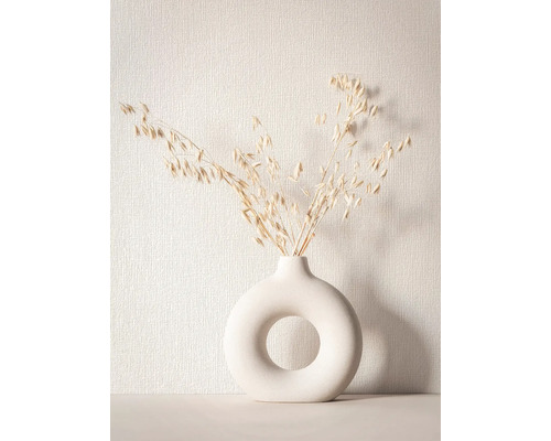 Fleurs séchées décoratives dans un vase rond avec ouverture