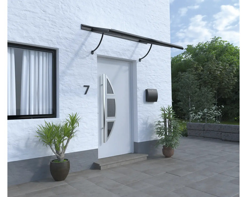 Entrée d''une maison avec auvent de porte, porte d''entrée, boîte aux lettres et plantes