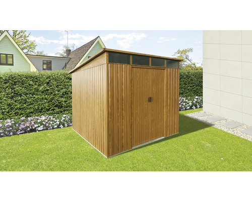 Abri de jardin en bois avec toit plat dans le jardin