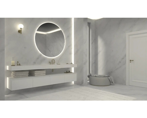 Salle de bains moderne avec miroir rond, lavabo et espace de rangement