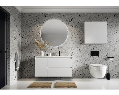 Salle de bains moderne avec meuble-lavabo, armoire de toilette, miroir rond avec éclairage et WC suspendu.