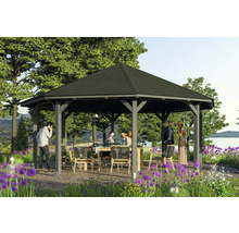 Pavillon avec table et chaises dans le jardin pour une fête