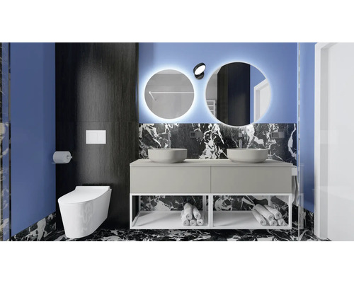 Salle de bains moderne avec double vasque, miroirs ronds avec éclairage et WC suspendu.