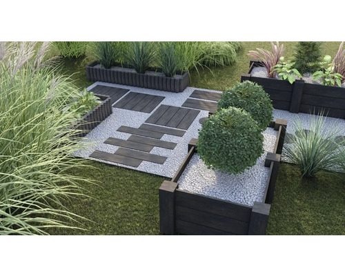 Jardin aménagé avec parterres surélevés, chemin de pierres et plantes vertes