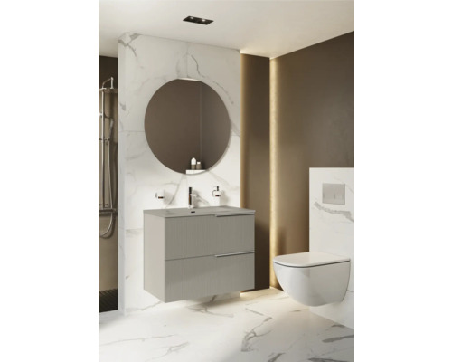 Modernes Badezimmer mit Waschtischunterschrank, rundem Spiegel und Wand-WC.