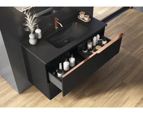 Meuble sous-lavabo avec tiroir ouvert dans une salle de bain