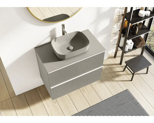 Meuble-lavabo gris avec vasque à poser et deux tiroirs dans la salle de bains