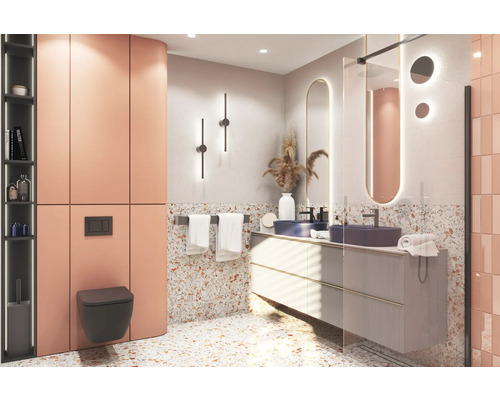 Salle de bains moderne avec lavabo, miroir, toilettes et carrelage aspect terrazzo.