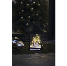 Lanterne décorative avec motif bonhomme de neige et sapin de Noël en arrière-plan