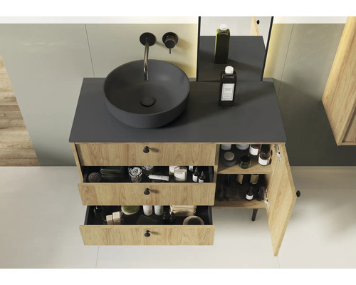 Salle de bains avec meuble sous-vasque, lavabo à poser et tiroirs ouverts pour le rangement