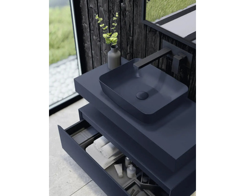 Meuble-lavabo avec lavabo à poser, robinetterie et tiroir ouvert dans un design moderne