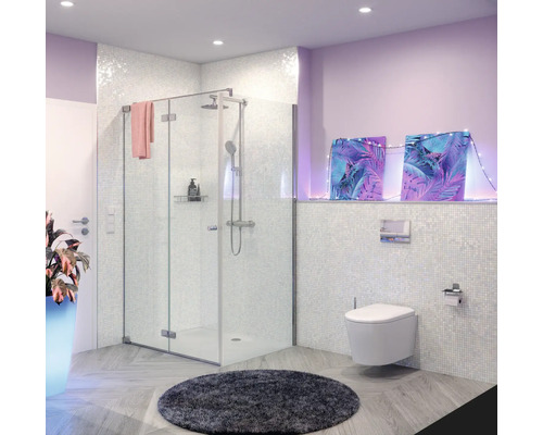 Salle de bains moderne avec cabine de douche, toilettes et tapis rond