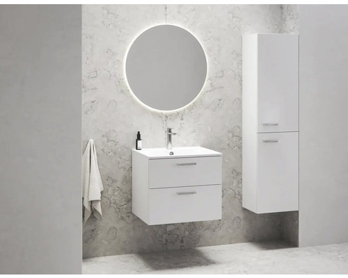 Salle de bains avec miroir rond, meuble sous-vasque et armoire haute