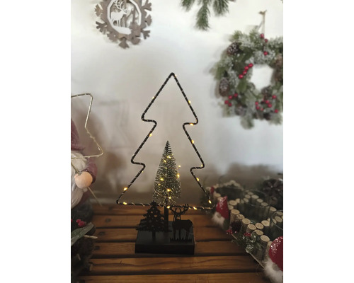 Weihnachtsdekoration mit Baumumriss und beleuchteter Tanne