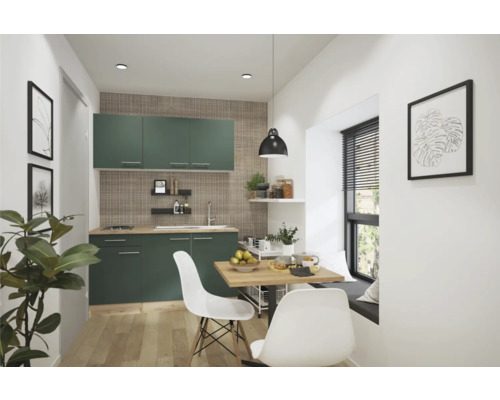 Cuisine claire avec placards verts, table à manger et banquette près de la fenêtre