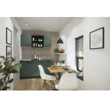 Cuisine moderne avec placards verts, table à manger et chaises.