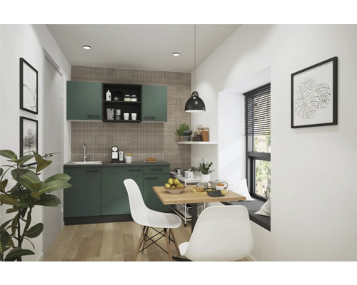 Cuisine moderne avec placards verts, table à manger et chaises.