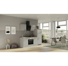 Salon lumineux avec kitchenette, table à manger et chaises