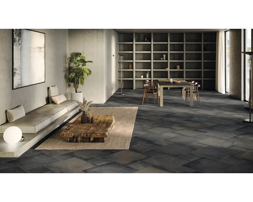 Salon moderne avec carrelage gris foncé, canapé et table en bois