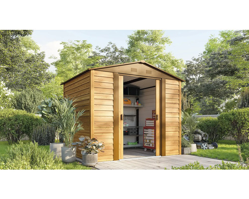 Abri de jardin avec portes coulissantes et outils de jardin dans le jardin