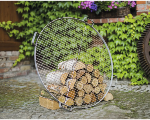 Grille de barbecue ronde en métal avec bois de chauffage