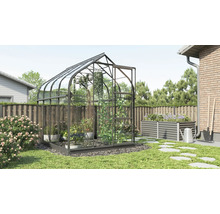 Serre de jardin avec parterre surélevé et outils de jardin