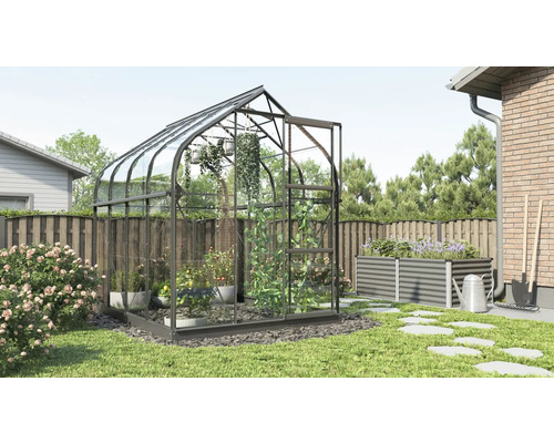 Serre de jardin avec parterre surélevé et outils de jardin