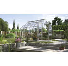 Serre de jardin avec plantes et mobilier de jardin
