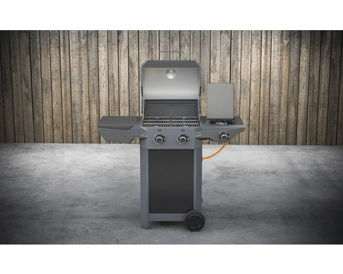 Gril à gaz avec couvercle ouvert et brûleur latéral