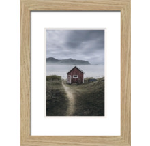 Gerahmtes Bild mit einem kleinen Haus in einer Küstenlandschaft