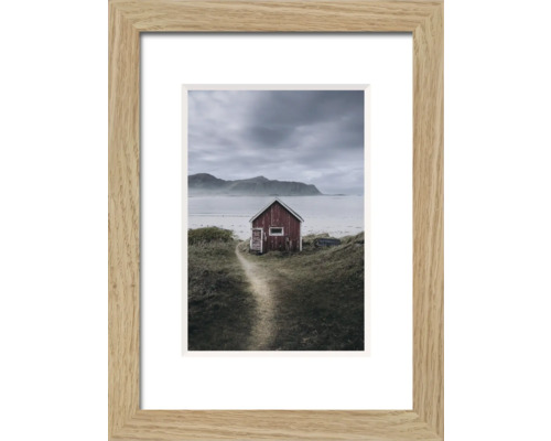 Gerahmtes Bild mit einem kleinen Haus in einer Küstenlandschaft
