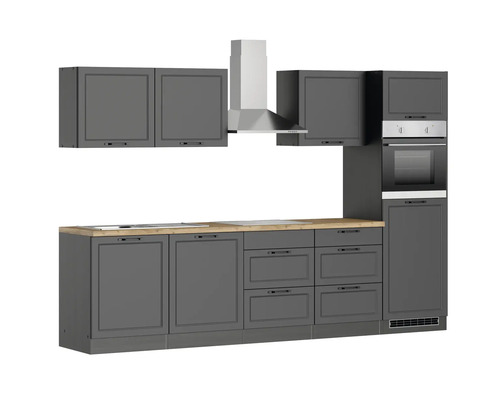 Cuisine complète avec hotte, armoires suspendues, four intégré et plan de travail.