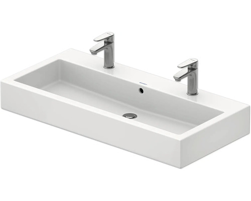 Lavabo rectangulaire blanc avec deux robinets