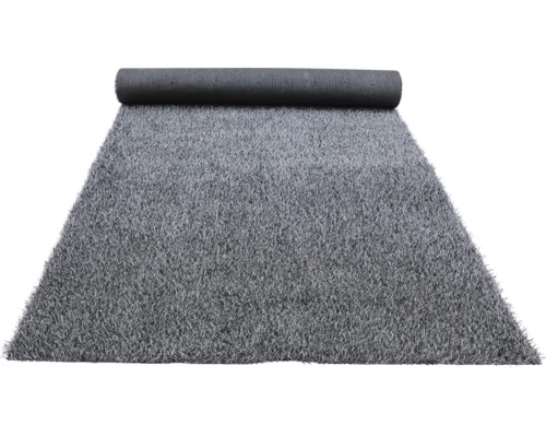 Gazon synthétique gris partiellement enroulé.