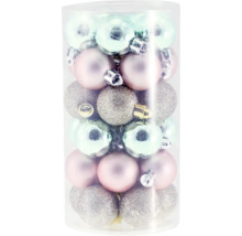 Boules de Noël de différents modèles et couleurs dans un tube transparent