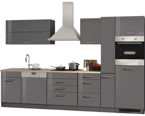 Cuisine intégrée moderne avec évier, plaque de cuisson, hotte aspirante et four