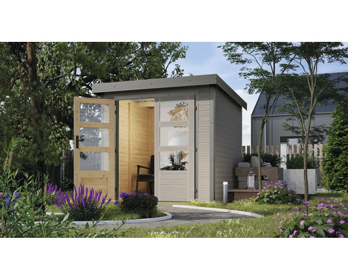 Abri de jardin avec porte double et fenêtres dans le jardin