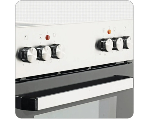 Gros plan d''une cuisinière avec boutons de commande et poignée