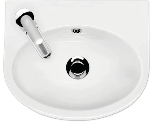 Vue de dessus d''un lavabo en céramique avec robinetterie et garniture de vidange