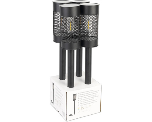 Vier schwarze LED Solar Gartenleuchten auf einer Verpackung