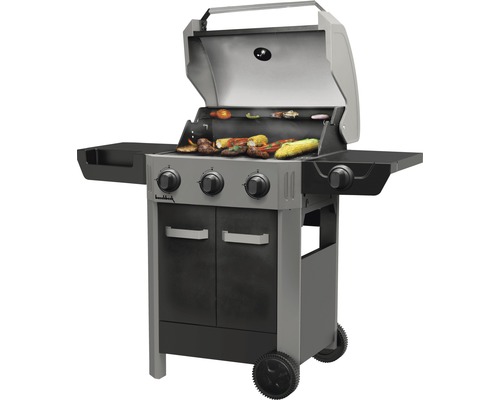 Barbecue à gaz avec des aliments grillés et un couvercle ouvert