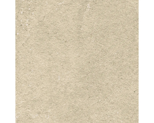 Gros plan d''un carreau beige à la texture rugueuse.