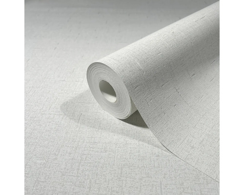 Rolle mit weißer Tapete mit leichter Struktur.